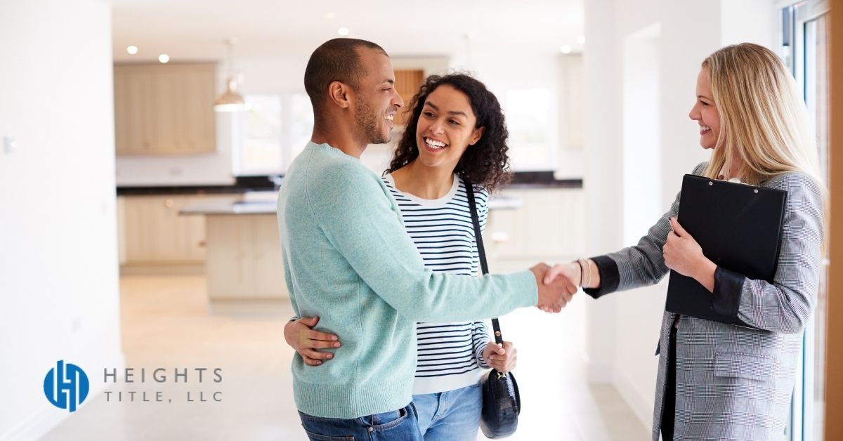 lady shaking hands with new homeowner